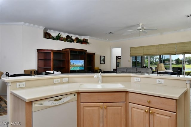 kitchen featuring white dishwasher, ceiling fan, a sink, crown molding, and open floor plan