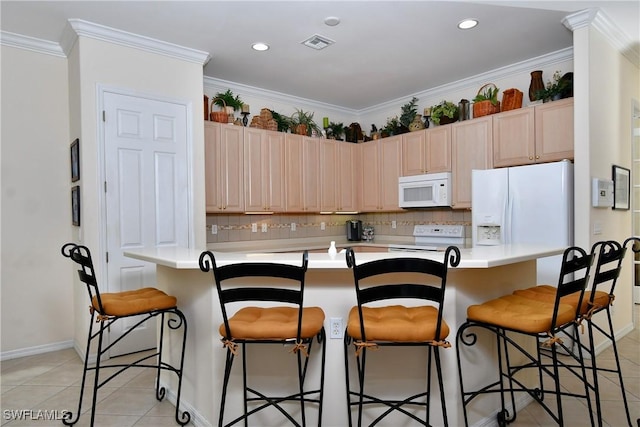 kitchen with white appliances, visible vents, ornamental molding, decorative backsplash, and light countertops