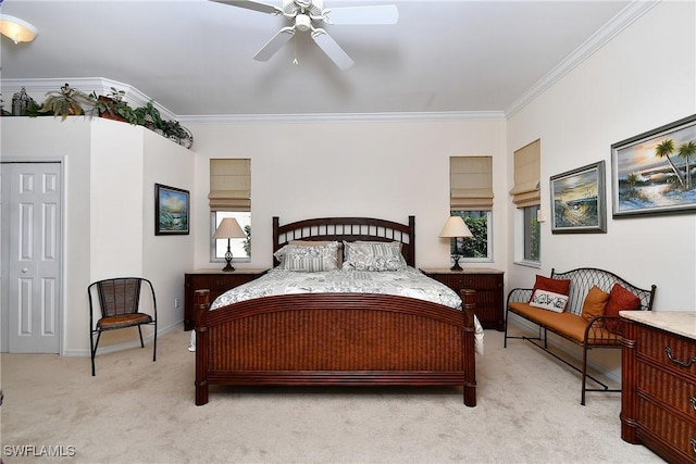 bedroom featuring light carpet, baseboards, crown molding, and ceiling fan