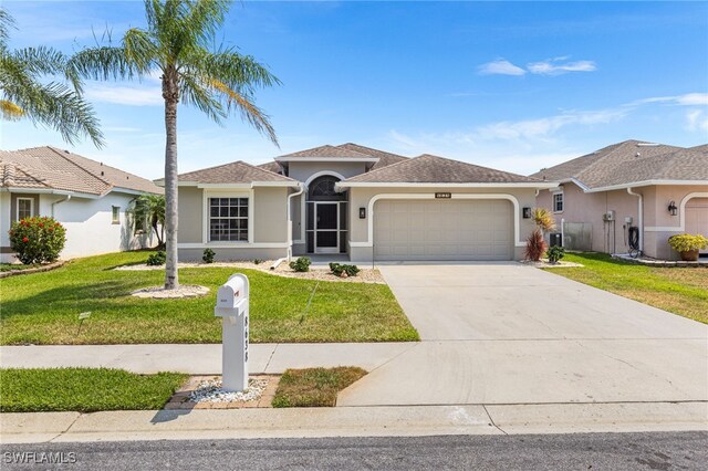 view of front of property with a garage, a front lawn, stucco siding, and driveway