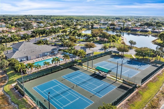 drone / aerial view featuring a water view and a residential view