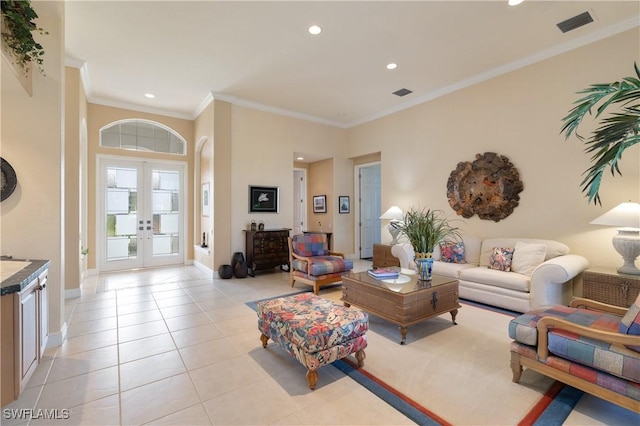 living area featuring crown molding, baseboards, light tile patterned floors, recessed lighting, and french doors