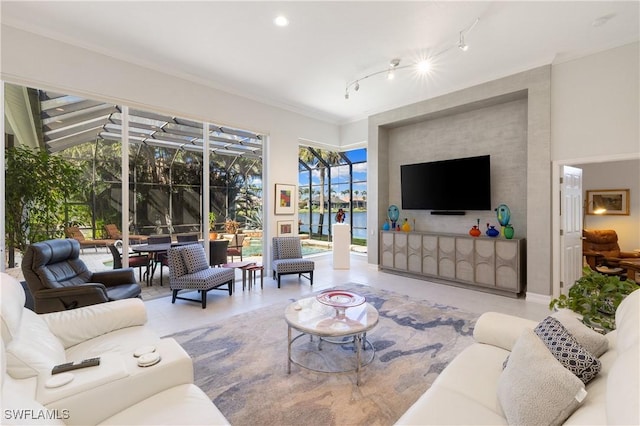 living room featuring track lighting and a sunroom