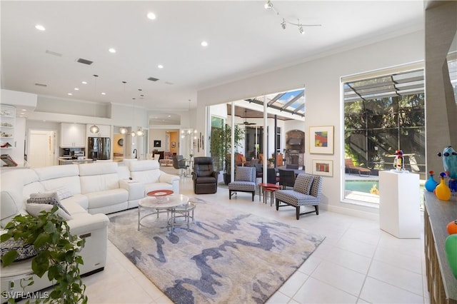 living area featuring light tile patterned floors, a healthy amount of sunlight, and recessed lighting