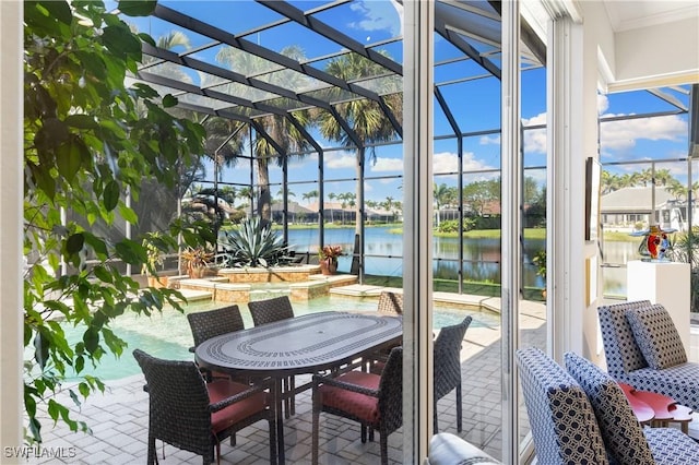 sunroom / solarium with a water view