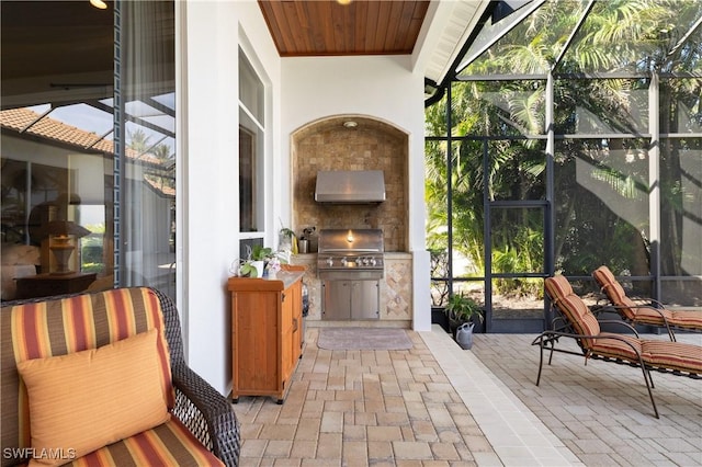 view of patio / terrace featuring a lanai and area for grilling