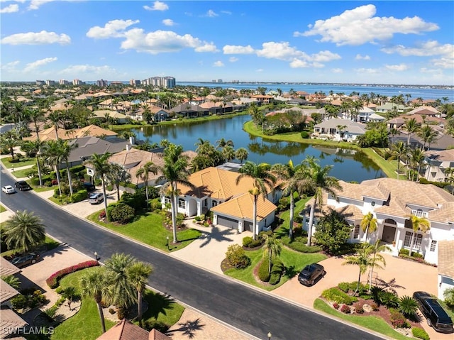 bird's eye view with a residential view and a water view