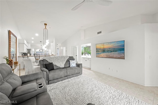 living area with light tile patterned floors, visible vents, recessed lighting, vaulted ceiling, and ceiling fan with notable chandelier