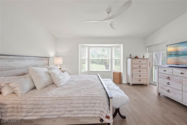 bedroom featuring light wood finished floors and ceiling fan