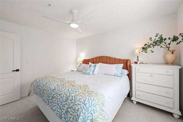 bedroom with light carpet and ceiling fan