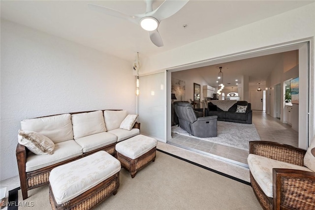 living room with vaulted ceiling and ceiling fan