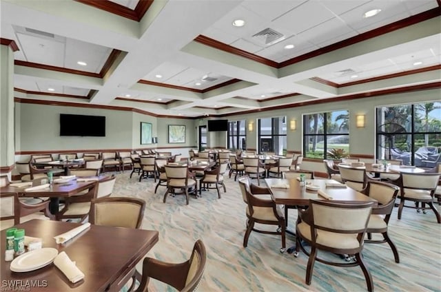 dining area featuring visible vents, wainscoting, coffered ceiling, and crown molding