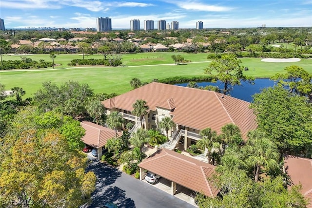 aerial view featuring a water view and golf course view