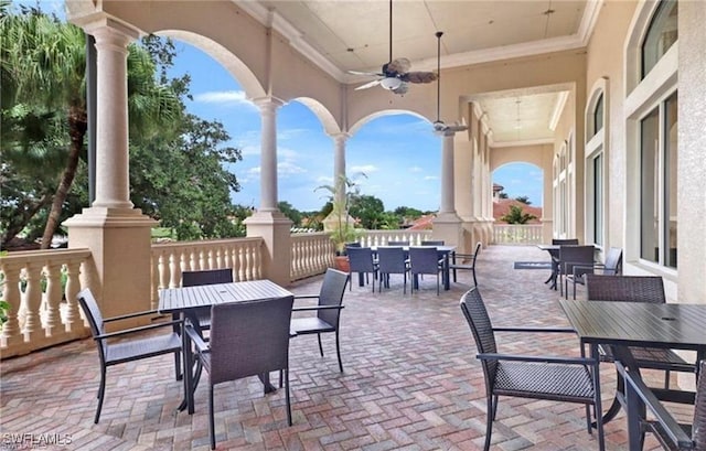 view of patio / terrace with outdoor dining area and a ceiling fan