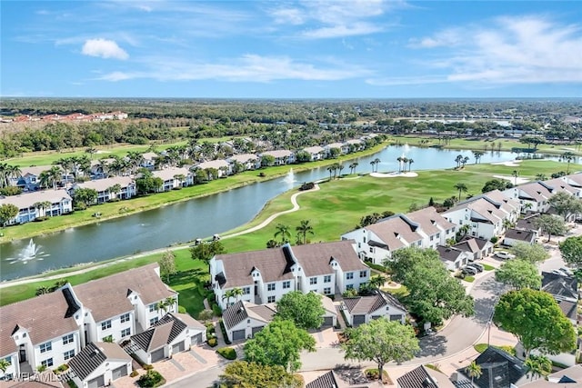 bird's eye view with a residential view, a water view, and view of golf course