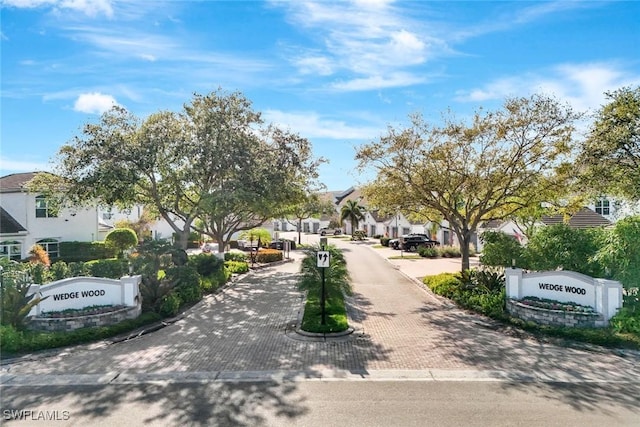 view of street featuring sidewalks, curbs, and a residential view