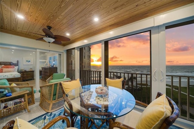 dining room featuring recessed lighting, ceiling fan, tile patterned flooring, wood ceiling, and a water view