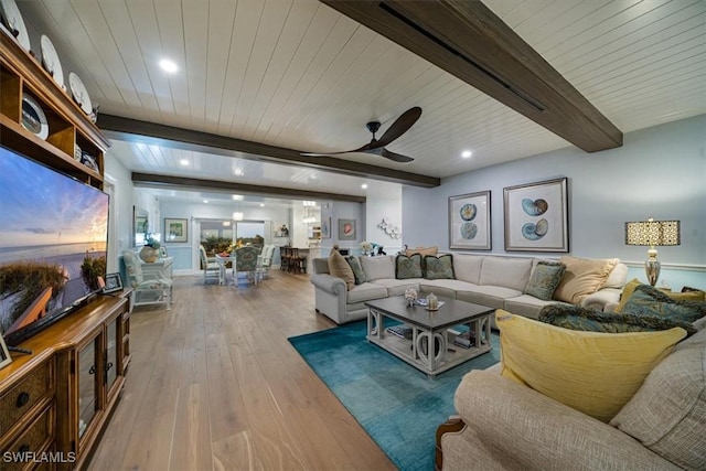 living room with recessed lighting, beamed ceiling, ceiling fan, and hardwood / wood-style flooring