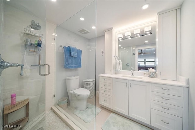 bathroom featuring visible vents, toilet, a stall shower, tile patterned flooring, and vanity