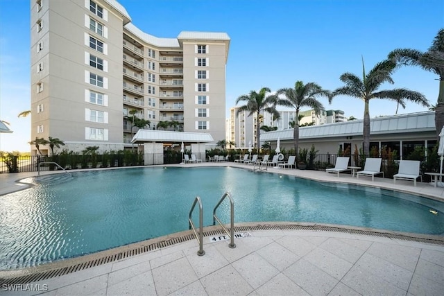 pool featuring a patio and fence