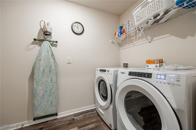 laundry area with washer and clothes dryer, laundry area, baseboards, and dark wood-style floors