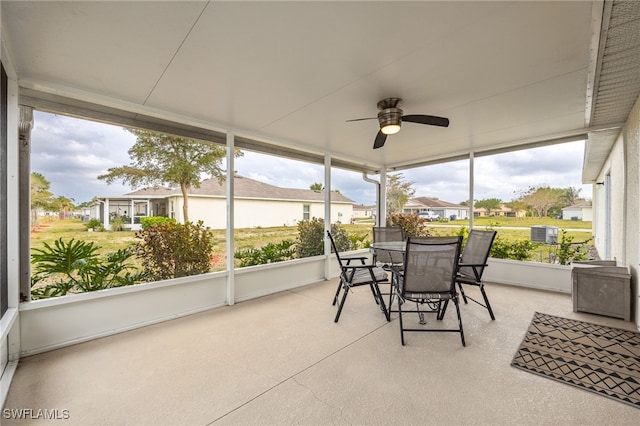 sunroom with a ceiling fan