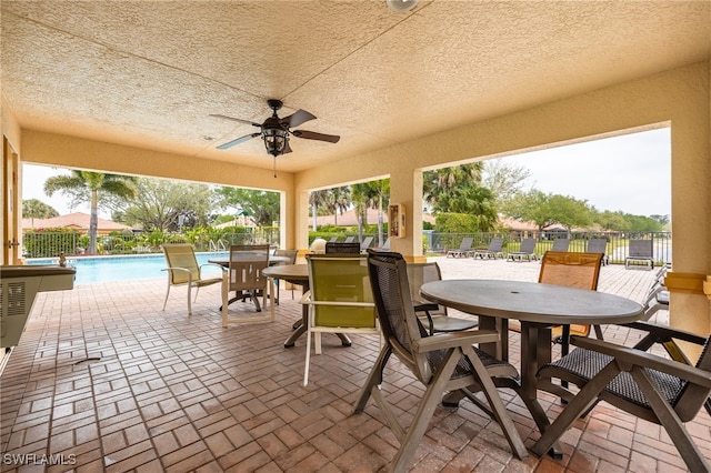 sunroom / solarium with ceiling fan