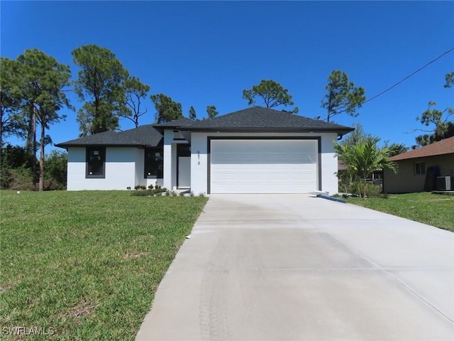 view of front of home with a garage, driveway, a front lawn, and stucco siding