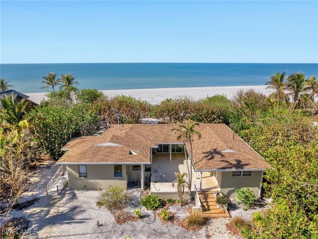 bird's eye view with a beach view and a water view