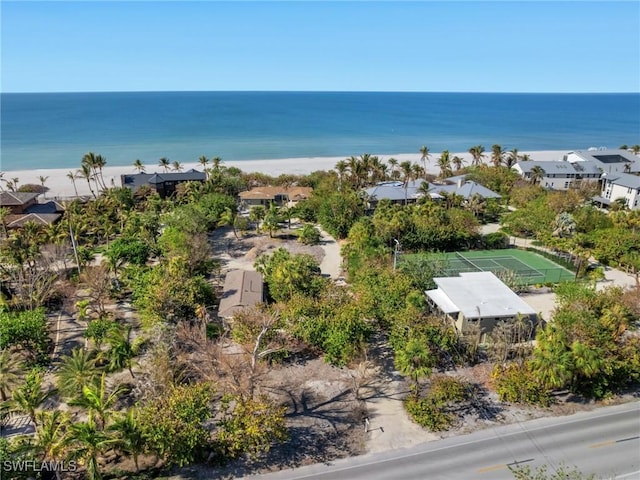 aerial view with a residential view, a water view, and a beach view