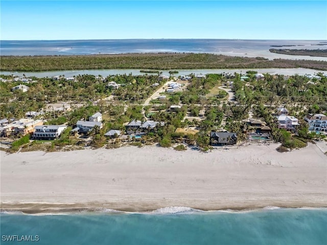 aerial view featuring a water view and a view of the beach