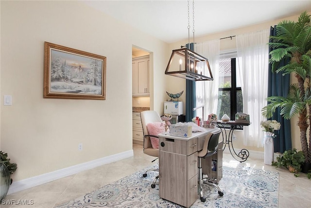 dining space featuring light tile patterned floors and baseboards