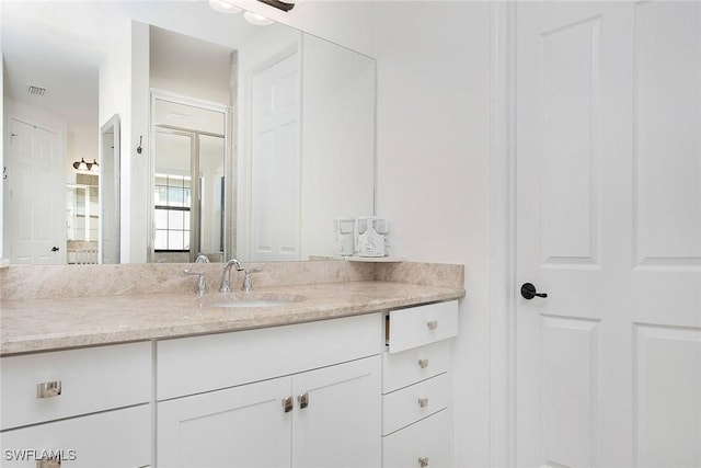 bathroom featuring vanity and visible vents