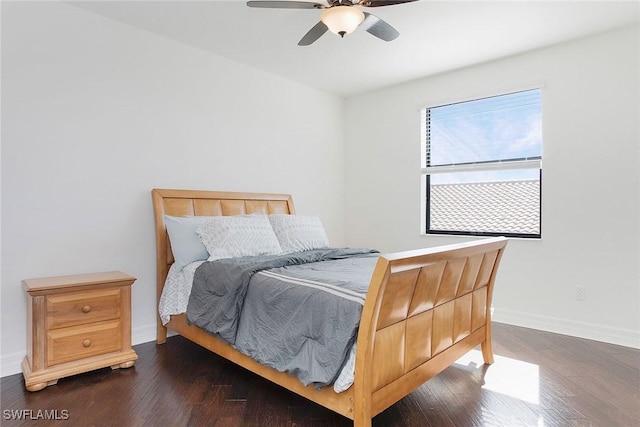 bedroom with dark wood-style floors, baseboards, and ceiling fan