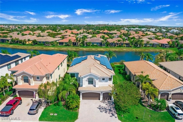 bird's eye view with a residential view and a water view