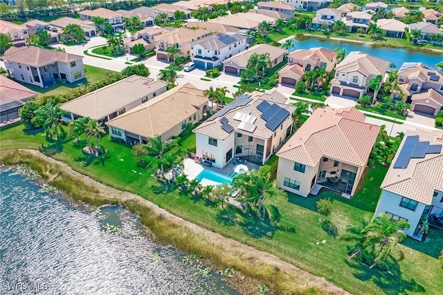 aerial view featuring a residential view and a water view