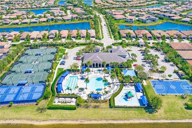 birds eye view of property featuring a residential view and a water view