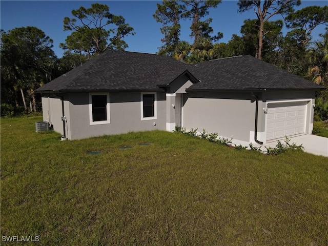 ranch-style house with central AC, a shingled roof, stucco siding, a front lawn, and a garage