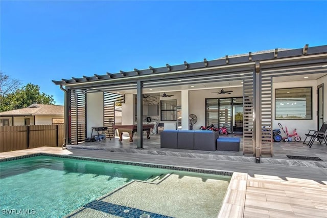 rear view of house featuring fence, outdoor lounge area, a fenced in pool, ceiling fan, and a patio area