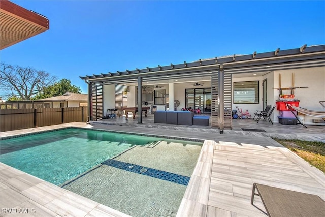 rear view of house featuring a fenced in pool, fence, an outdoor hangout area, a patio, and a ceiling fan