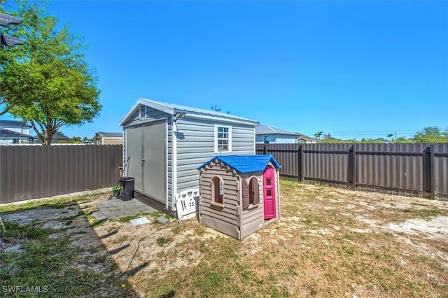 view of shed with a fenced backyard