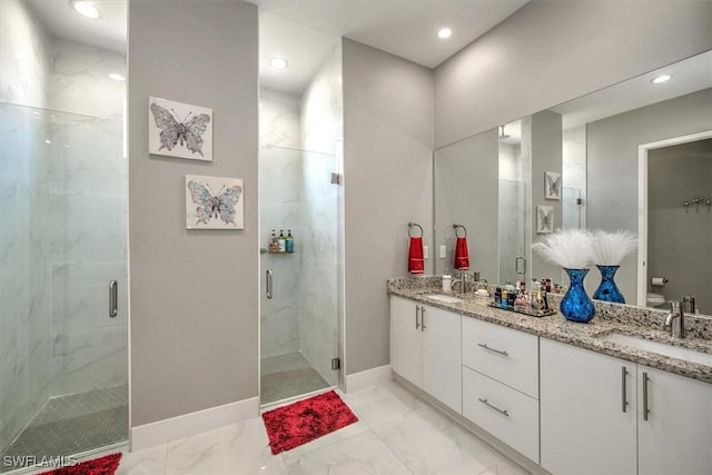 bathroom featuring a sink, a marble finish shower, and marble finish floor