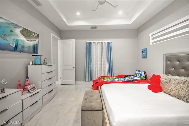 bedroom with a raised ceiling, recessed lighting, visible vents, and marble finish floor