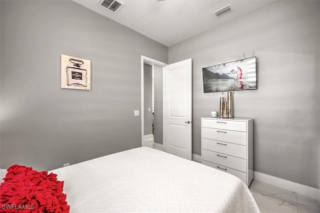 bedroom featuring visible vents, marble finish floor, and baseboards