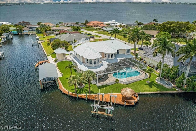 birds eye view of property featuring a water view and a residential view