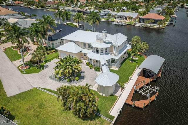 bird's eye view with a residential view and a water view