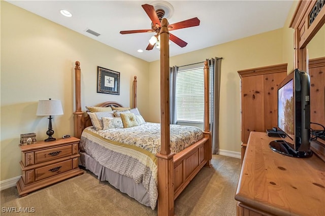 bedroom featuring baseboards, visible vents, recessed lighting, ceiling fan, and light carpet