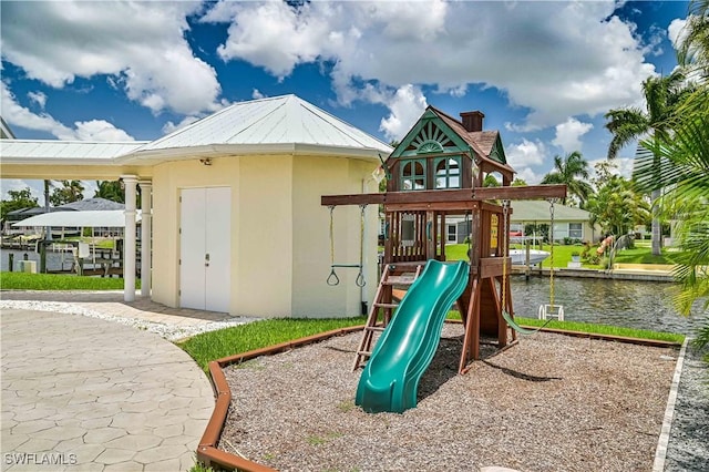 view of play area with a water view