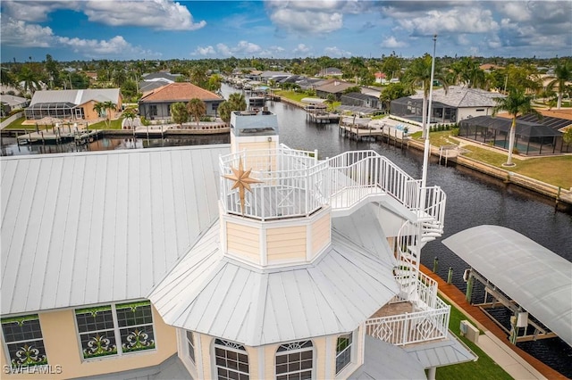 aerial view with a residential view and a water view