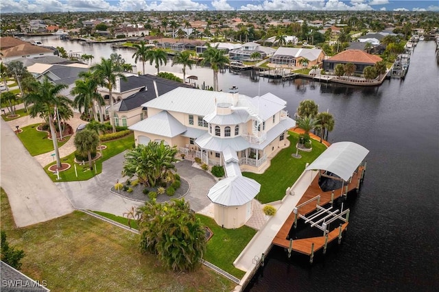 bird's eye view featuring a residential view and a water view